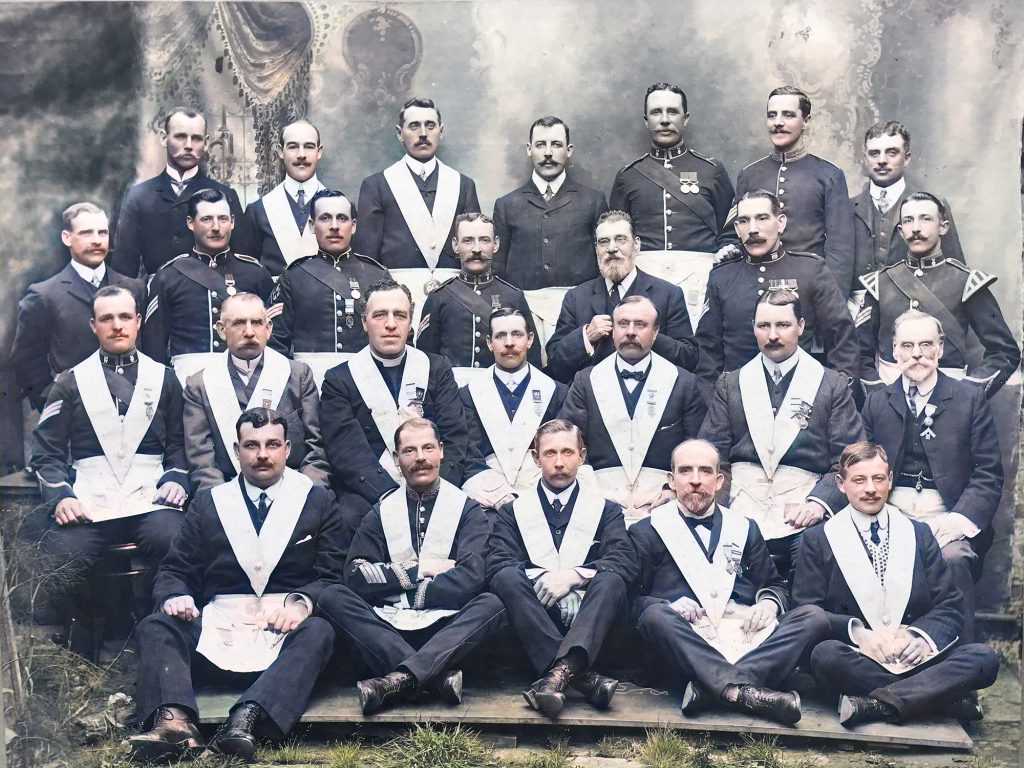 Colour reproduction of the black and white photo of the members in 1909