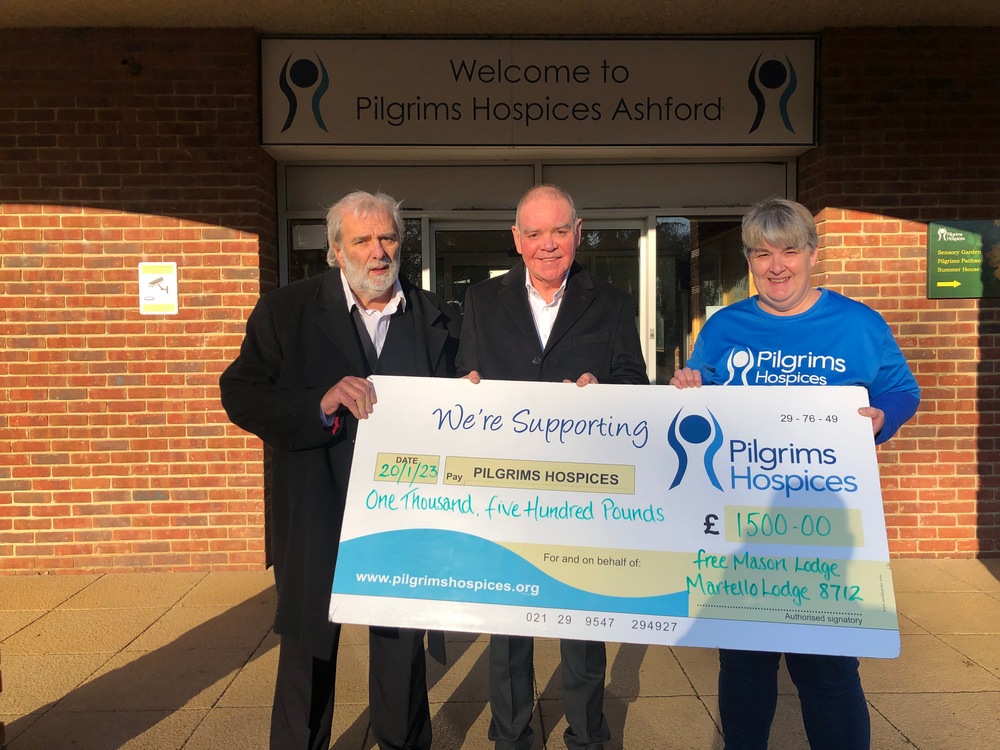 Outside Pilgrims Hospice with Peter McHugh, rep from Pilgrims and Paul Akast, Worshipful Master in the middle