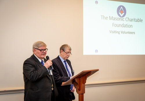 A picture of Kevin Kemp and Eddie Halpin, delivering their part of the meeting, Visiting Volunteers. 
