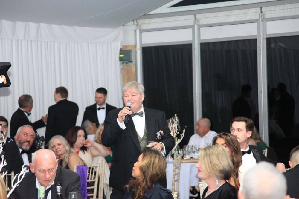 Kevin Kemp as auctioneer at work, mike in hand.
