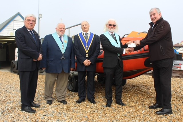 Freemasons from Dover hand over a cheque to the Lifeboat station in Walmer