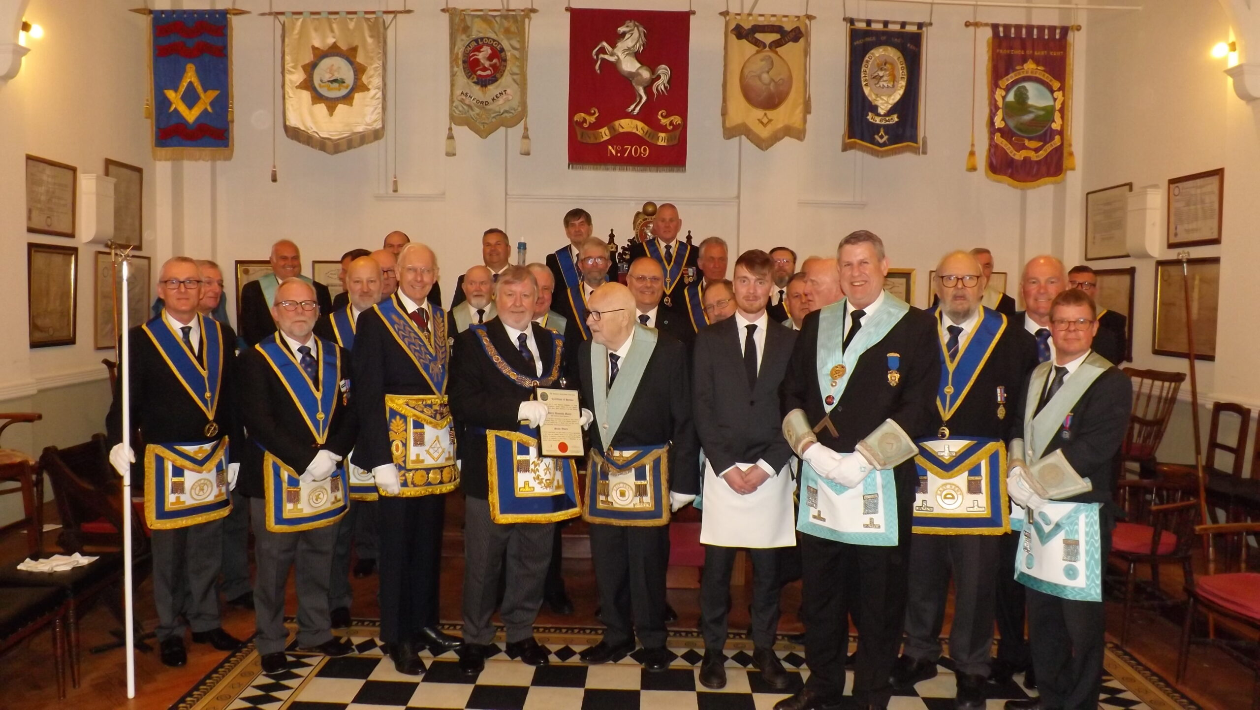 group photo of Matthew Harrison the new entrant with the recipient of the 60th Certificate along with members of the lodge and the Deputy Provincial Grand Master Phil South