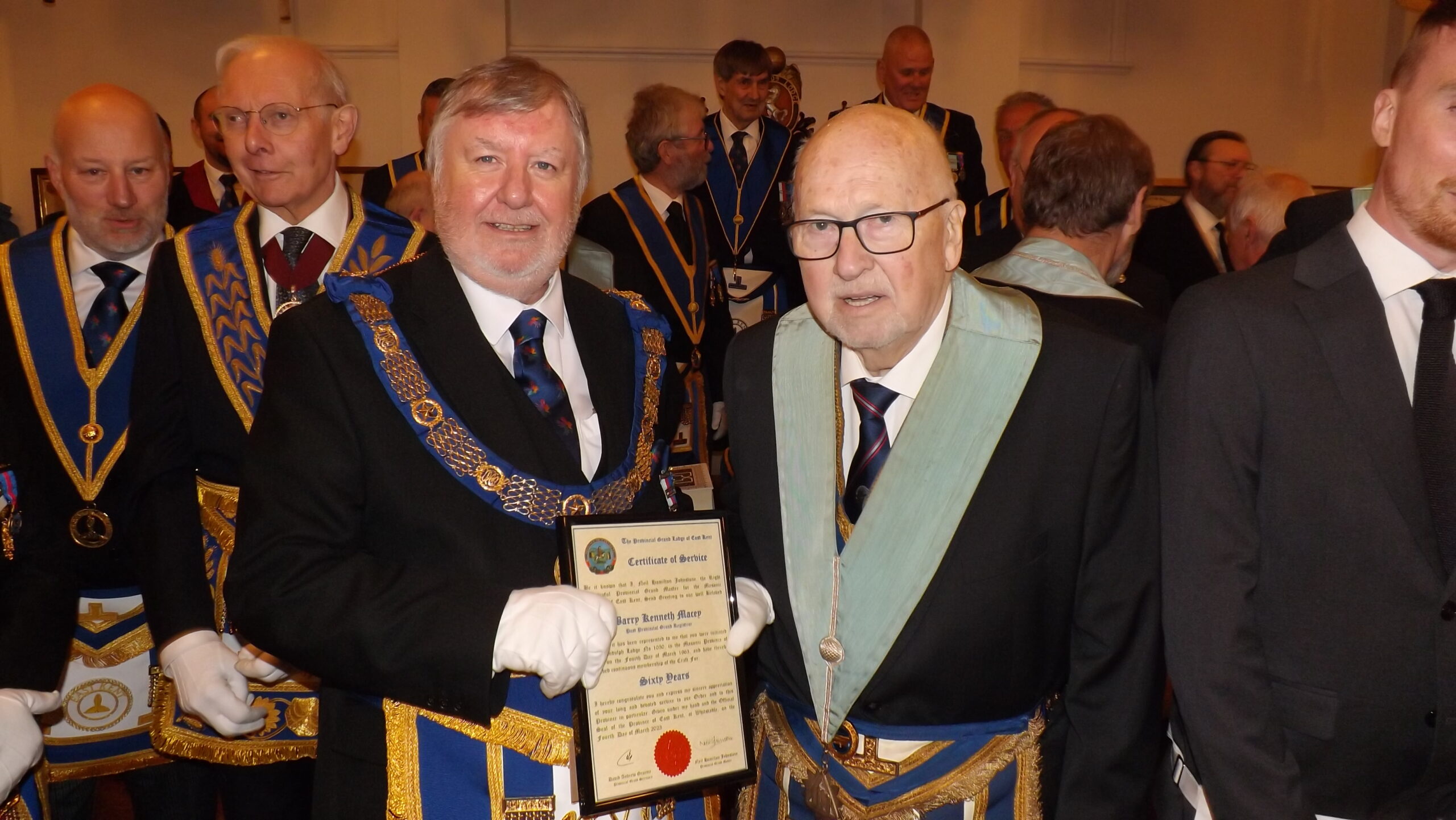 Picture of the Deputy Provincial Grand Mater Phil South, presenting the 60th certificate to WBro Barry Macey