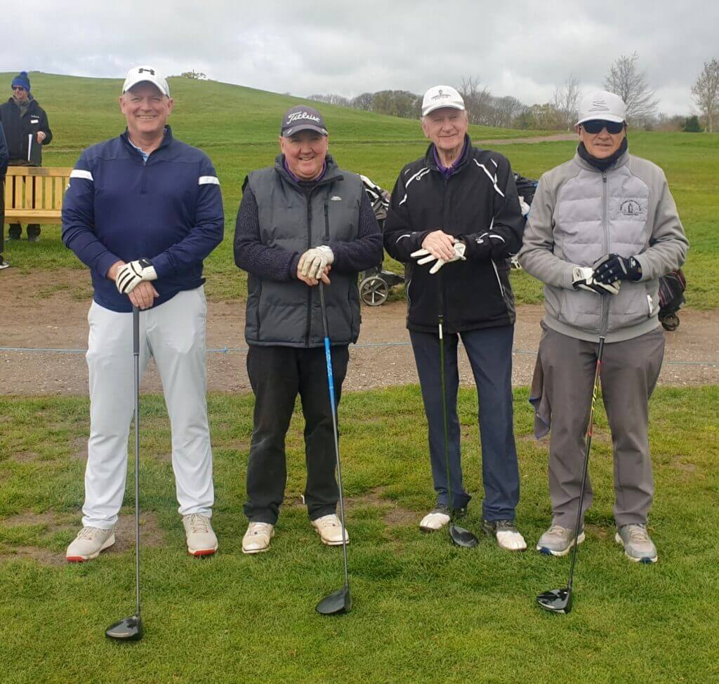 Image of some of the competitors ready to Tee Off, holding their drivers