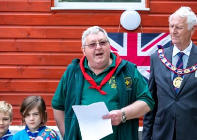 Picture of the Scout leader taking to the visitors during the opening ceremony of the new refurbished toilet block.