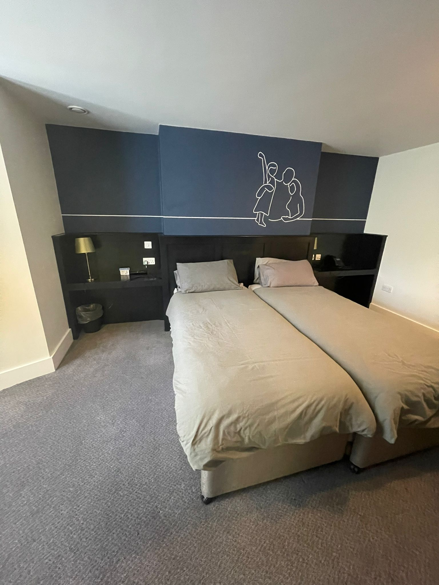 an image of one of the rooms in the house, having been refurbished, new bed, headboard, 
