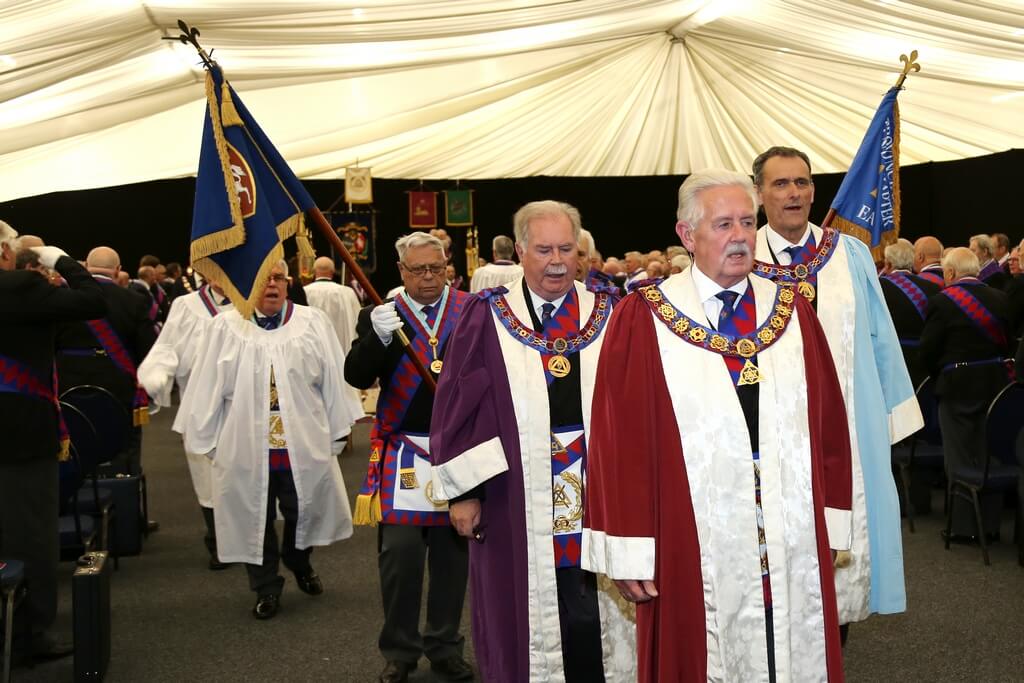 picture of the 1st Principle, Neil Hamilton Johnstone leading the parade as they enter the Provincial Grand Chapter