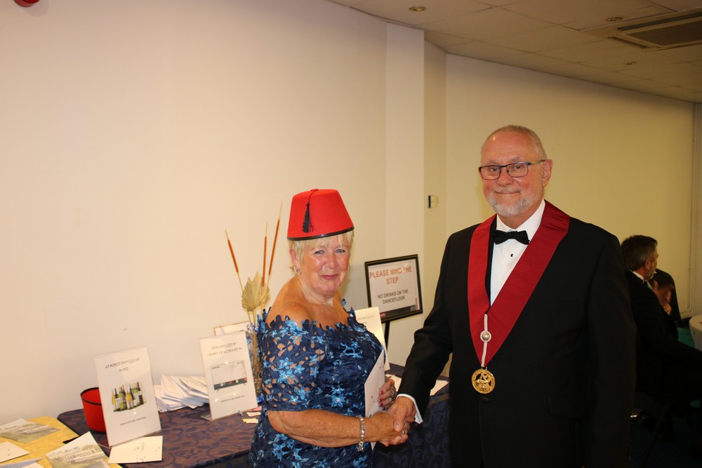 Mrs Kay Bearman wins a Taittinger Champagne branded flute gift set. Presented by WBro Peter Le Page