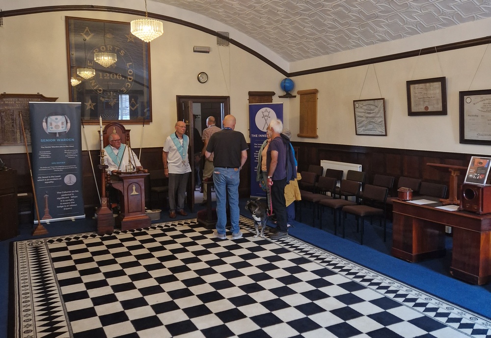 Visitors talking to lodge members inside the main lodge room
