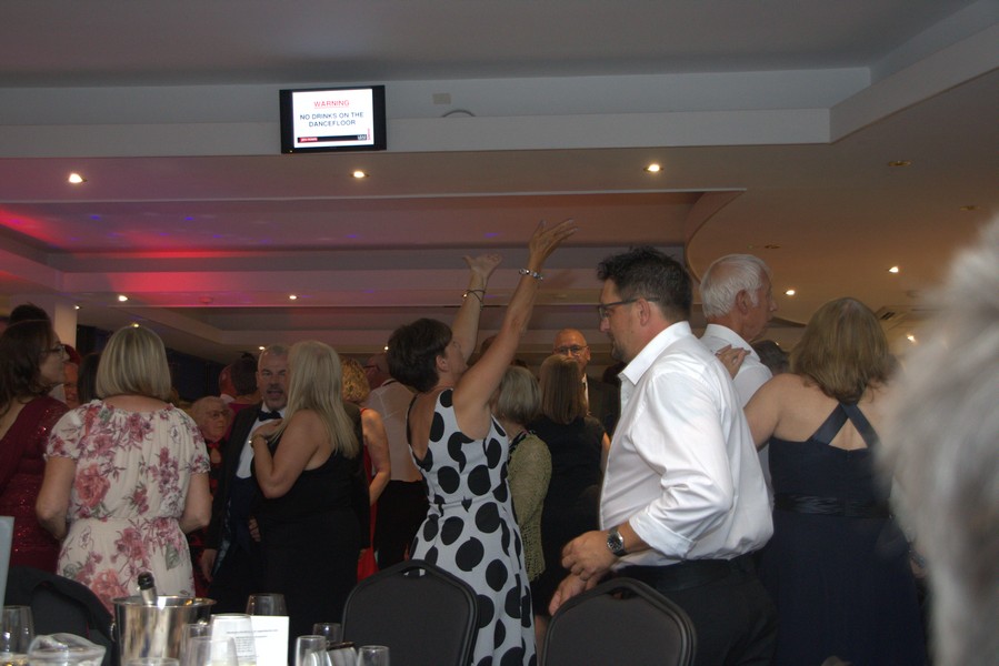 Picture of attendees dancing to the music of Plastic Orange